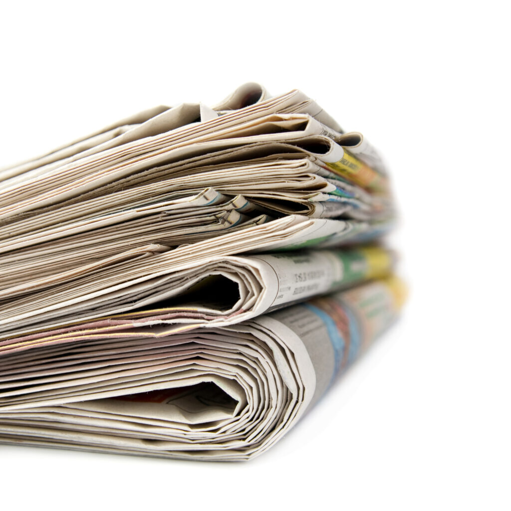 stack-of-folded-newspapers-on-a-white-background-2026-03-17-06-01-17-utc