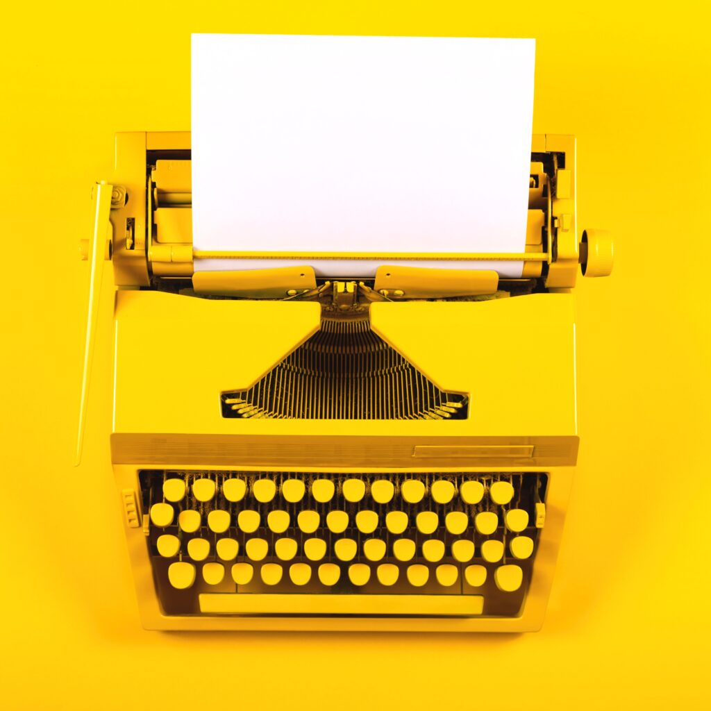 yellow-typewriter-with-blank-white-paper-sheet-2026-01-07-06-00-26-utc